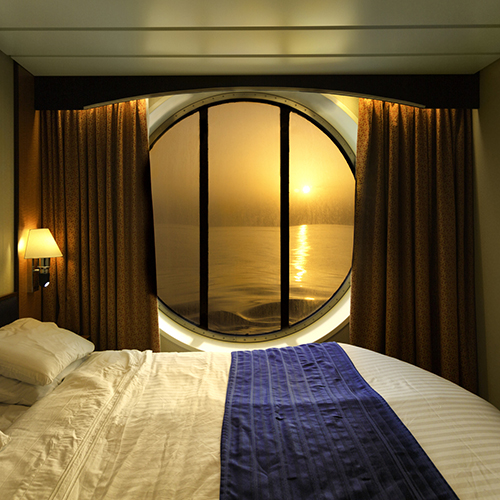 How can you make your cruise cabin feel bigger?