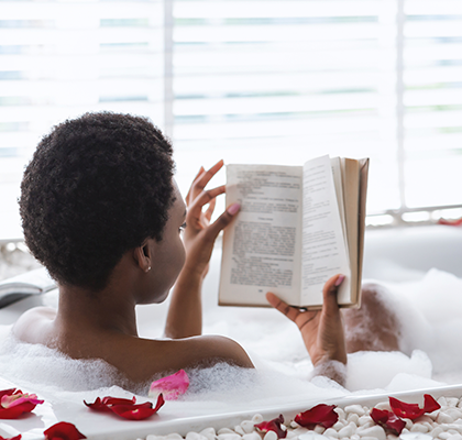 A woman enjoys a self-care ritual for Valentine's Day.